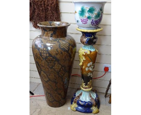 A Majolica glazed ceramic jardiniere stand, a modern grapevine design jardiniere, and a large floor standing covered composit