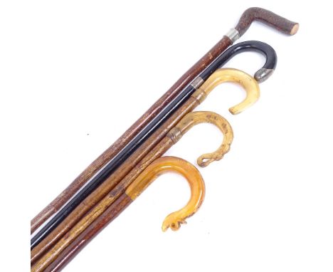 3 ram's-horn handled walking sticks, a Victorian silver-mounted ebonised walking stick, and 1 other (5) 