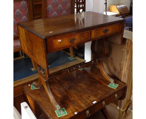 A reproduction crossbanded mahogany sofa table, with fitted drawers, on lyre end supports, W88cm, H73cm, D51cm 