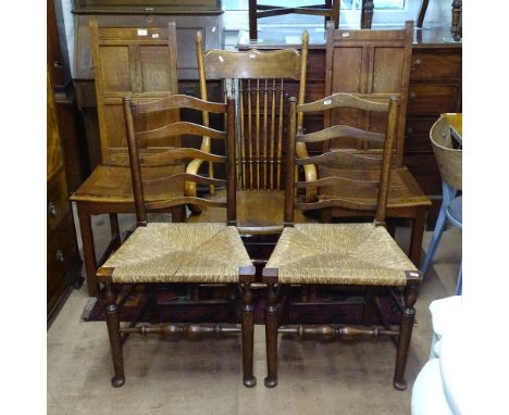 A pair of panelled oak hall chairs, a pair of rush-seated ladder-back chairs on pad feet, and a stick-back armchair (5) 