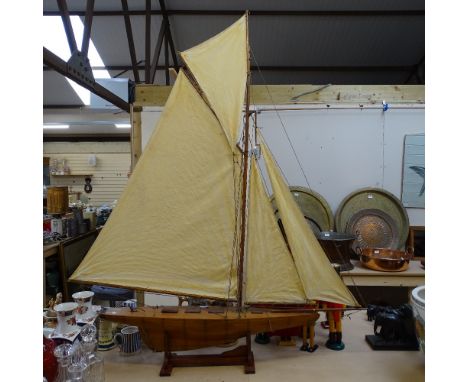 A Vintage pond yacht with sails, length 115cm overall, on stand 