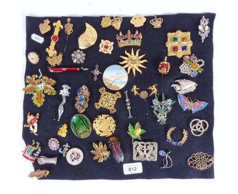 A collection of costume brooches, to include micro-mosaic, a carved ivory brooch, a stylised silver and opal set brooch etc 