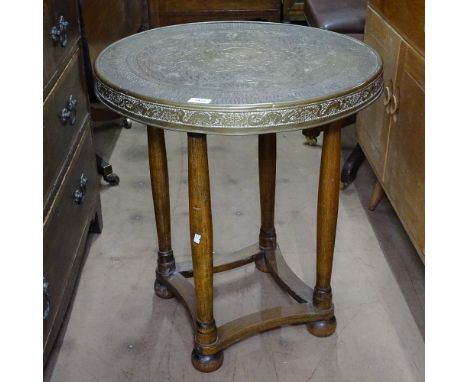 An Austrian secessionist side or lamp table, on oak base, with Orientalist engraved brass top, W60cm, H67cm