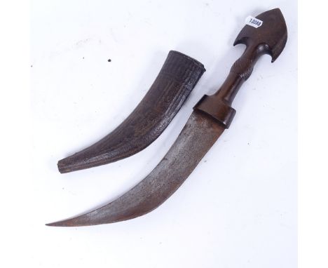 An Arab curved Jambiya dagger, with carved horn hilt and original embossed leather scabbard, blade length 22cm 