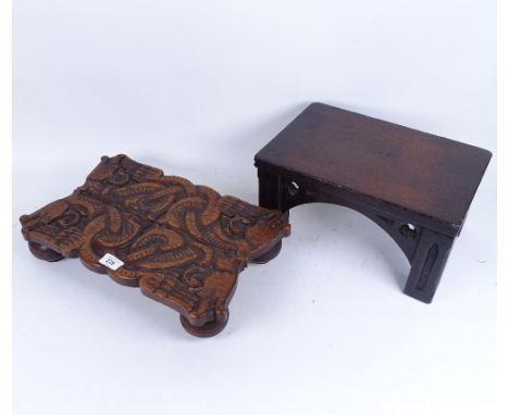 A Victorian Gothic carved oak rectangular stool, length 35cm, and a relief carved oak dragon design stand, length 42cm (2) 