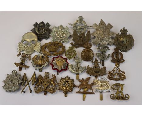 A Collection Of 25 British Military Badges To Include The Royal Leicestershire Regiment, The Essex Regiment, The Kings Own Ma