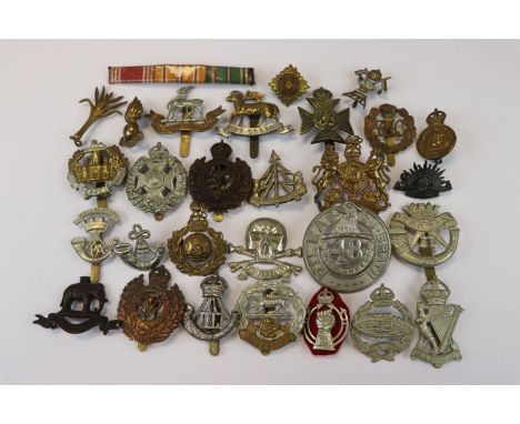 A Collection Of 25 British Military Badges To Include The Essex Regiment, The Army Catering Corps, The Rifle Brigade, The Que
