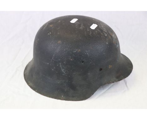 A World War Two / WW2 German Helmet, Over Painted And In Relic Condition.