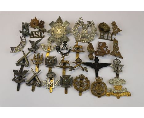 A Collection Of 30 British Military Badges To Include The Royal Pioneer Corps, The Warwickshire Yeomanry Regiment, The Royal 