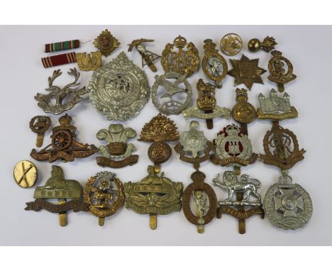 A Collection Of 25 British Military Badges To Include The Welch Regiment, The Argyll And Sutherland Regiment, The Royal Corps