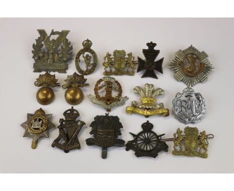 A Collection Of 15 British Military Cap Badges To Include The Royal Marine Artillery, The Tyneside Scottish Regiment, The Mid