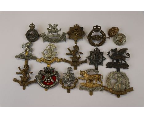 A Collection Of 15 British Military Cap Badges To Include The Royal Welch Fusiliers, The Queen Bay's 2nd Dragoon Guards, The 