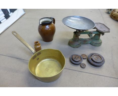 A set of scales with weights, brass jam pan and a stoneware jar