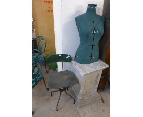 An industrial machinist's chair and mannequin