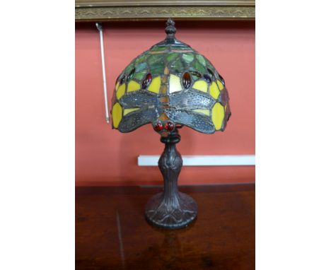 A small Tiffany style table lamp