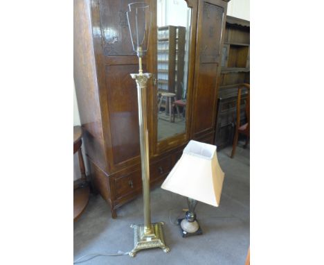 A brass Corinthian column standard lamp and a table lamp