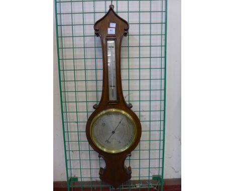 A mahogany aneroid barometer