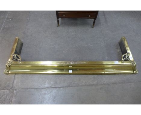 An Art Nouveau brass fender