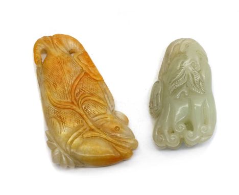 Two Chinese jade carvings, 20th century, one of a carp, grasping a lotus stem, 9.2cm long, and another, of a finger citron, w
