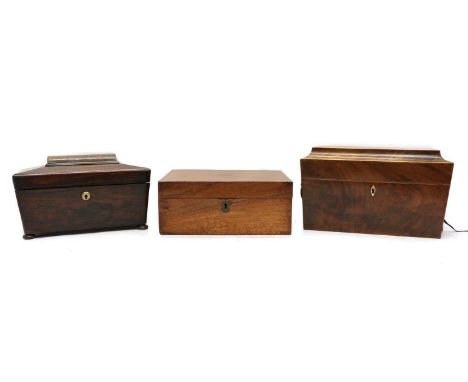A Victorian rosewood tea caddy,19th century, of sarcophagus form, on squat bun feet,31cm wide16cm deep17cm hightogether with 