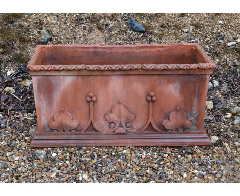 A faux terracotta garden fountain and trough,20th century, the fountain in the form of a classical upstand with bearded gentl