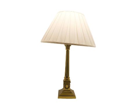 A brass table lamp, 20th century, modelled as a corinthian column fitted with a white shade50cm highCondition report: Used, s