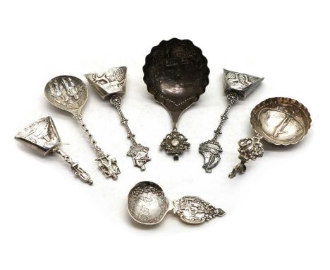 A collection of silver caddy spoons,predominantly Dutch, late 19th to early 20th century, assorted makers including Berthold 