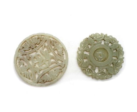 Two Chinese jade pendants, 20th century, one carved with a Fu character surrounded by four confronting bats, 5.5cm diameter, 