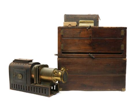 A Helioscopic magic lantern, 20th century, bearing label for Walker Sylvers, 48 Waterloo Road SE, in an outer wooden case, to