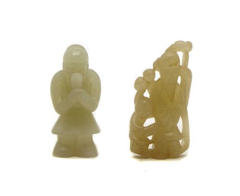 Two Chinese jade carvings,comprising: one of a scholar official with a hu board, 6cm high, and the other of Shou lao holding 
