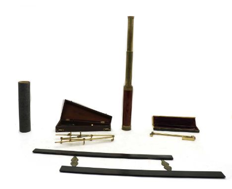 A brass pantograph,19th century, with a lead weight, pointer and ivory wheels, in a fitted mahogany case, 26cm long, an eboni