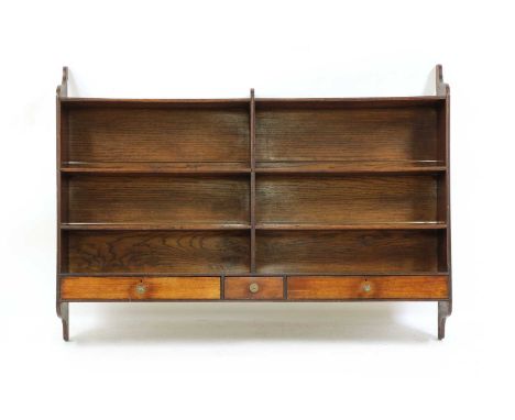 A mahogany hanging mahogany shelf,19th century, with shelves over three drawers, 147.5cm wide 21cm deep 108cm highCondition r