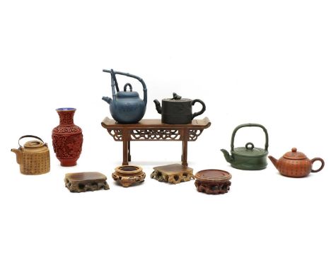 A collection of seven Chinese Yixing zisha, teapots, 20th century, decorated with an inscription, bamboo or landscape, smalle