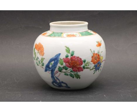 A Chinese famille rose jar, Qing dynasty (1644-1911), of globular form, painted with peony and other flowers by rocks, 15cm d