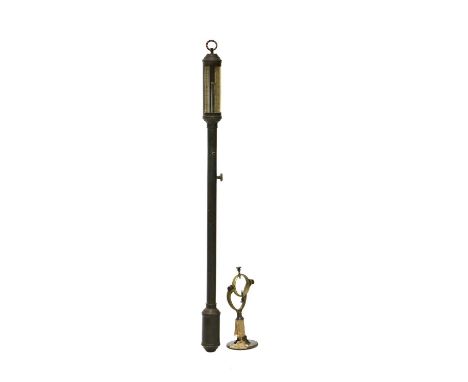 A reproduction brass ship's barometer, the silvered register engraved 'F. J. B. L. H. ? R. N. ..... Lisbon', mounted on a gim
