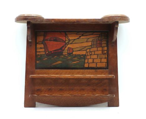 Arts and Crafts wall-hanging smoker's stand, early 20th century, centred with a stained panel depicting ships, above a seven-