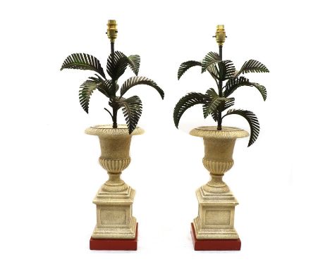 A pair of palm tree table lamps,of recent manufacture, the stylised palm tree leaves above an urn, each on square section ste