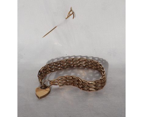 A 9ct yellow gold bracelet with V shaped links with a padlock clasp, approximately 17.5 grams together  with a yellow metal s