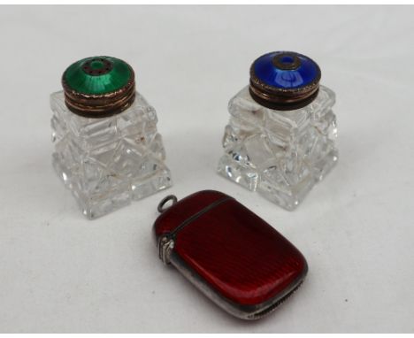 A continental white metal and red guilloche enamel vesta case, of oval form, marked 925, together with a pair Norwegian white