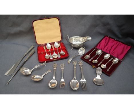 An Elizabeth II silver sauce boat, with a flared edge on three legs, Sheffield, 1963, together with a Victorian silver caddy 