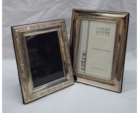 A modern silver photograph frame, of rectangular form with a Celtic pattern, 20 x 15cm together with another similar photogra