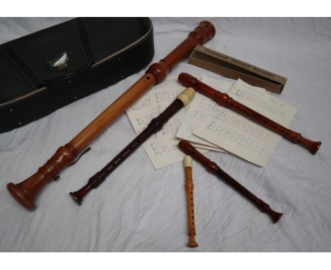 A Dolmetsch Bass recorder together with a collection of Dolmetsch recorders, sheet music etc CONDITION REPORT: sizes - 92.5cm