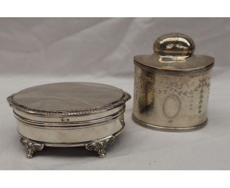 A George V silver tea caddy of oval form, decorated with swags and festoons to a vacant cartouche, Birmingham, 1910, George U