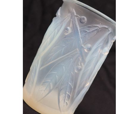 R Lalique, an opalescent cylindrical glass vase, decorated in the leaf and berry pattern, signed R LALIQUE, near to the base,