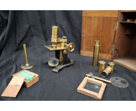 An R. Field &amp; Son brass monocular microscope, together with lenses and other accessories, boxed