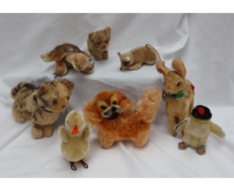 A Steiff cat, together with a kitten, turtle, duckling, mouse, deer, penguin and a Pekinese 