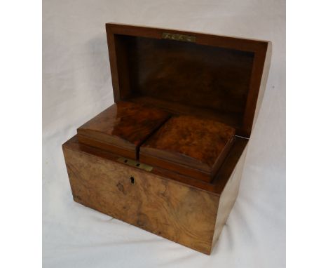 A Victorian walnut tea caddy, of domed form, the interior with two removable lidded compartments, 23cm wide