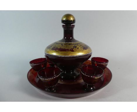 A Pretty Gilt Decorated Continental Ruby Glass Decanter Set Comprising Decanter Decorated with Cherubs and Grapes and Six Sho