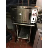 SS Oven, Vulcan, on SS table, 2 x 2 x 4 1/2 (dim. with table) Located: Main Kitchen, adjacent to