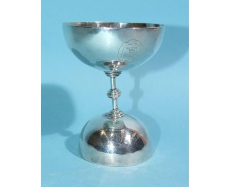 A white metal double-ended communion wine cup, each bowl connected to a knopped stem, the cups 6cm and 8.5cm diameter and eng